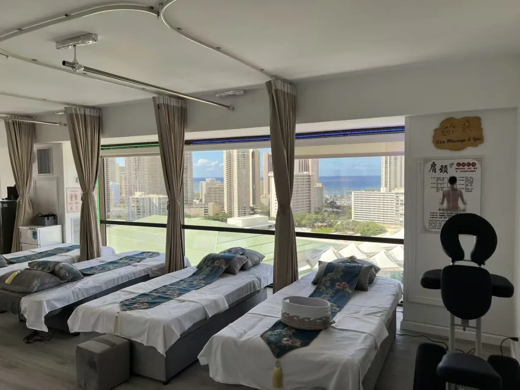 Massage beds overlooking the Honolulu skyline and ocean